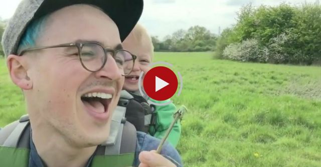 Baby Laughs At Dad Blowing Dandelions.